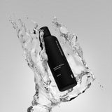 Hair Luxious Repair & Moisture Conditioner bottle surrounded by splashing water