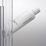 Hair Luxious Repair & Moisture Shampoo bottle against fluted glass